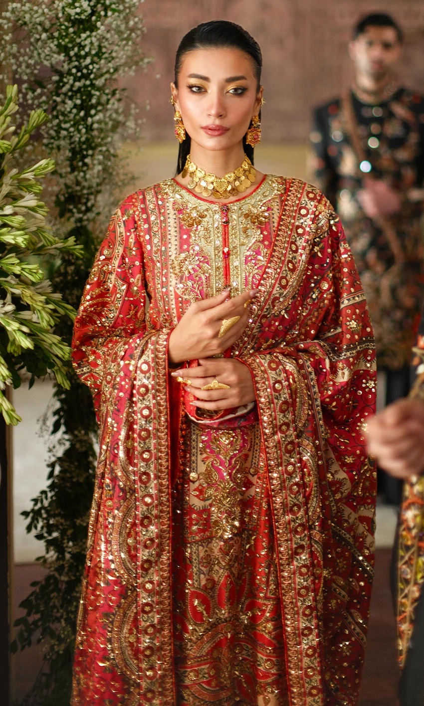 CRIMSON TALE I NOMI ANSARI clothing in gold, red tones.